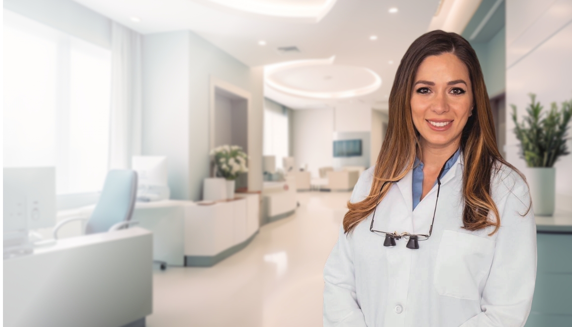 Doctor Bita Farhoumand smiling in dental office