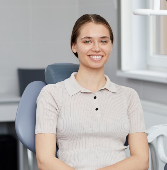 Smiling woman sitting in the dental chair